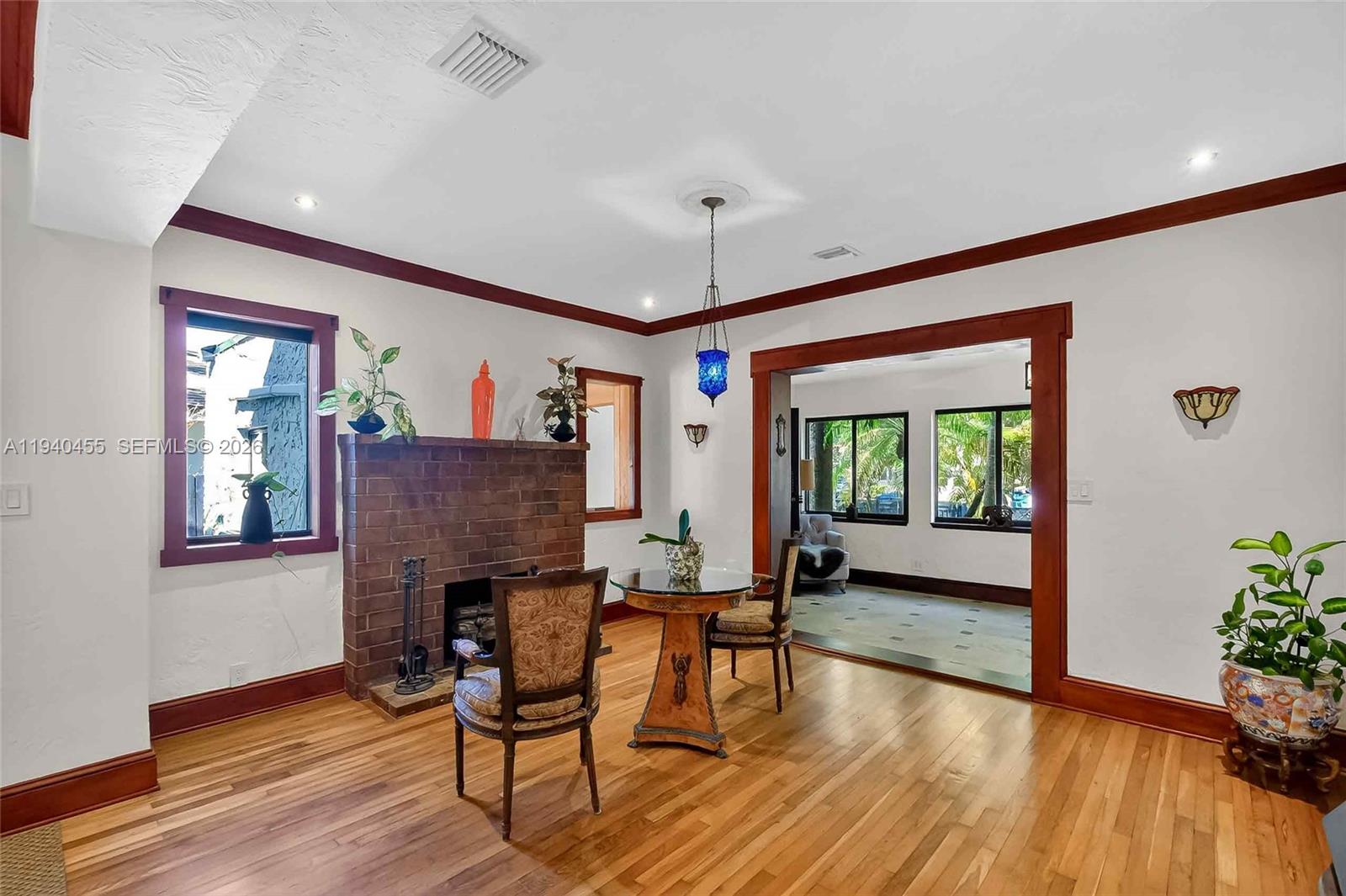452 Southwest 21st Road Miami, FL 33129 - Photo 16 of 51 a living room with furniture and a wooden floor
