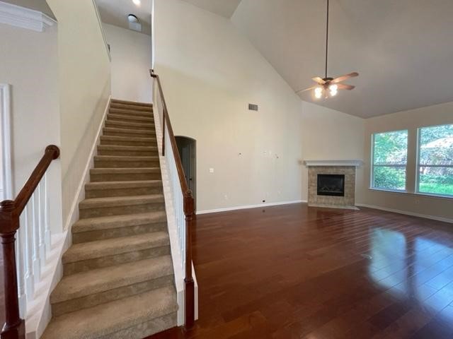 706 South Frontier Lane Cedar Park, TX 78613 - Photo 15 of 32 a view of an empty room with wooden floor fireplace and a window