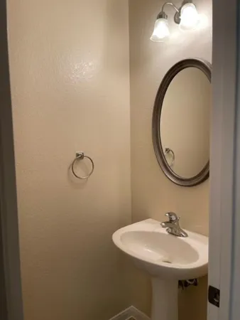 a bathroom with a sink and mirror