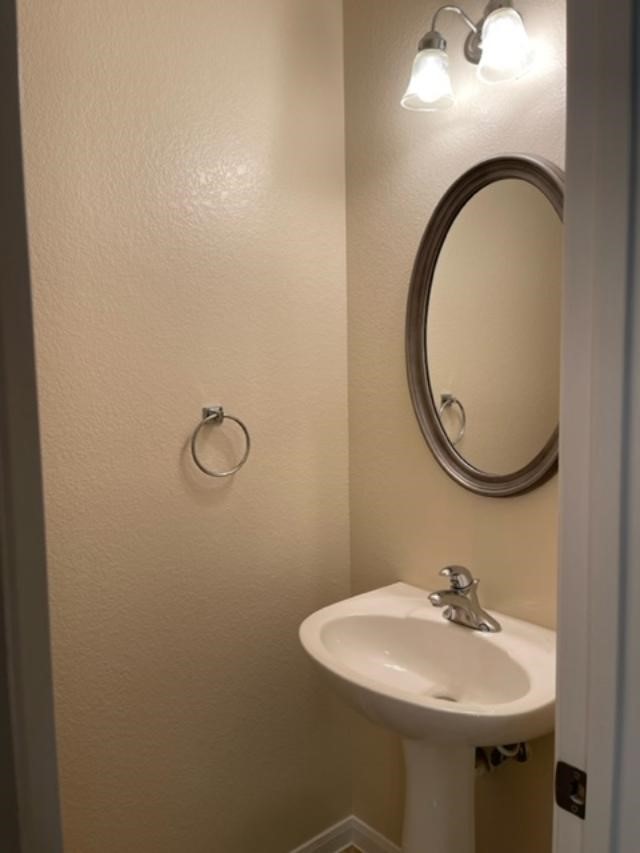 706 South Frontier Lane Cedar Park, TX 78613 - Photo 16 of 32 a bathroom with a sink and mirror