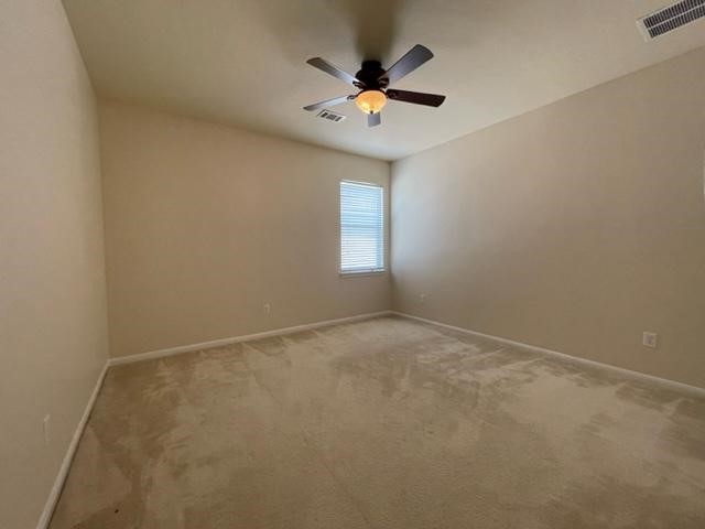 706 South Frontier Lane Cedar Park, TX 78613 - Photo 25 of 32 an empty room with a window and a fan
