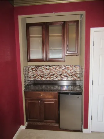 a stove top oven sitting inside of a kitchen