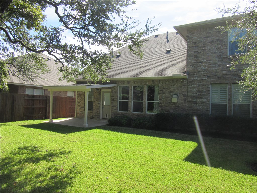 706 South Frontier Lane Cedar Park, TX 78613 - Photo 7 of 32 a view of a backyard with a garden
