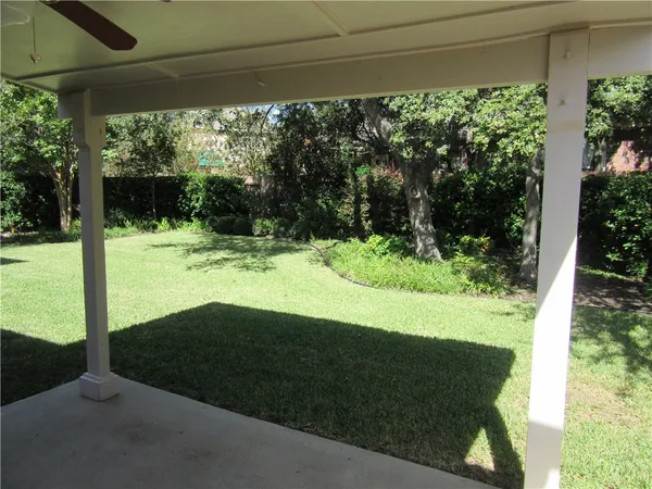 a view of a backyard of the house