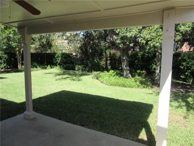 a view of a backyard of the house