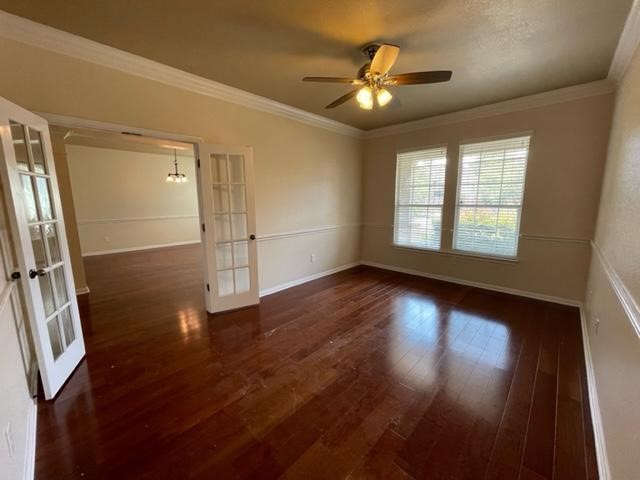 706 South Frontier Lane Cedar Park, TX 78613 - Photo 10 of 32 an empty room with wooden floor and windows