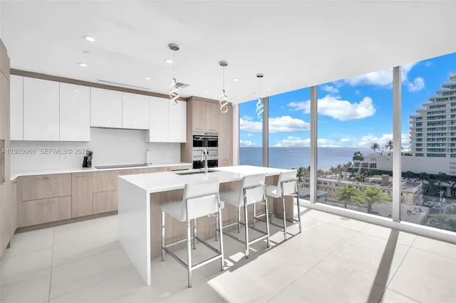 a kitchen with a sink and white cabinets