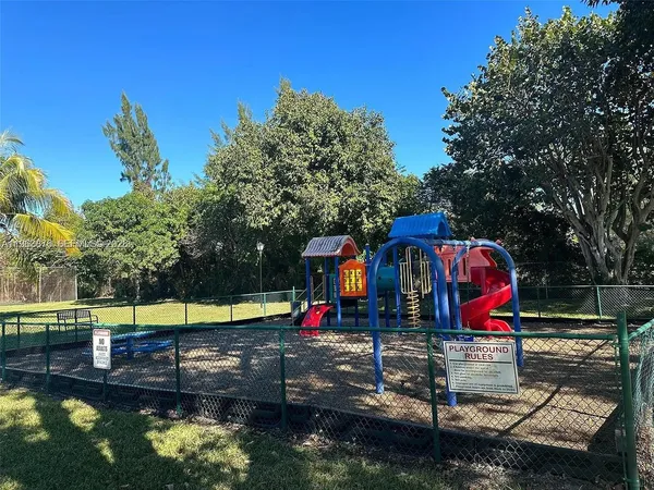 a view of swimming pool with sitting area and furniture