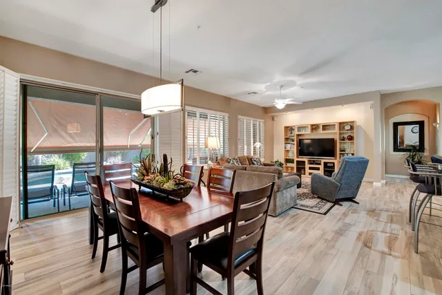 a kitchen with stainless steel appliances granite countertop a sink a stove and cabinets