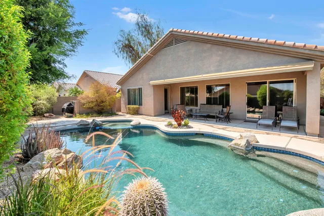 a view of a swimming pool with a garden
