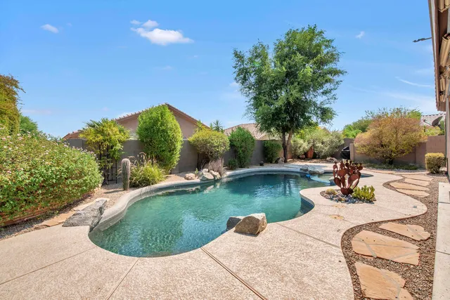 a view of pool with outdoor seating