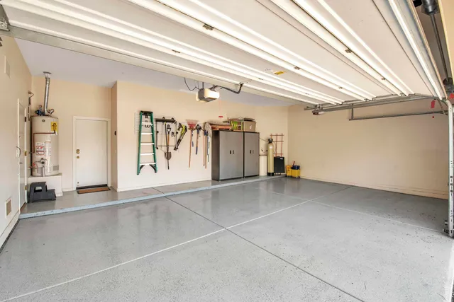 a sign on a wall next to a road