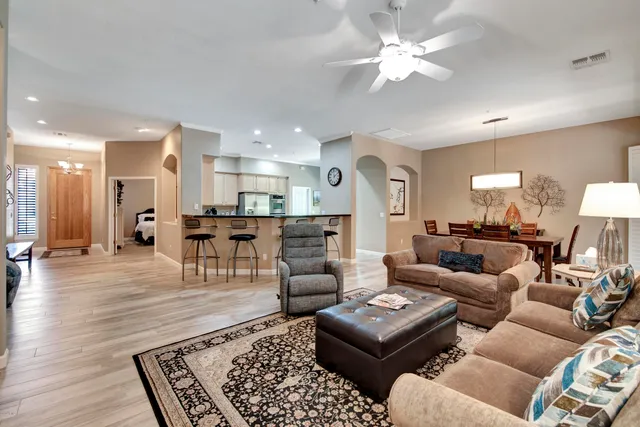 a living room with furniture and a rug