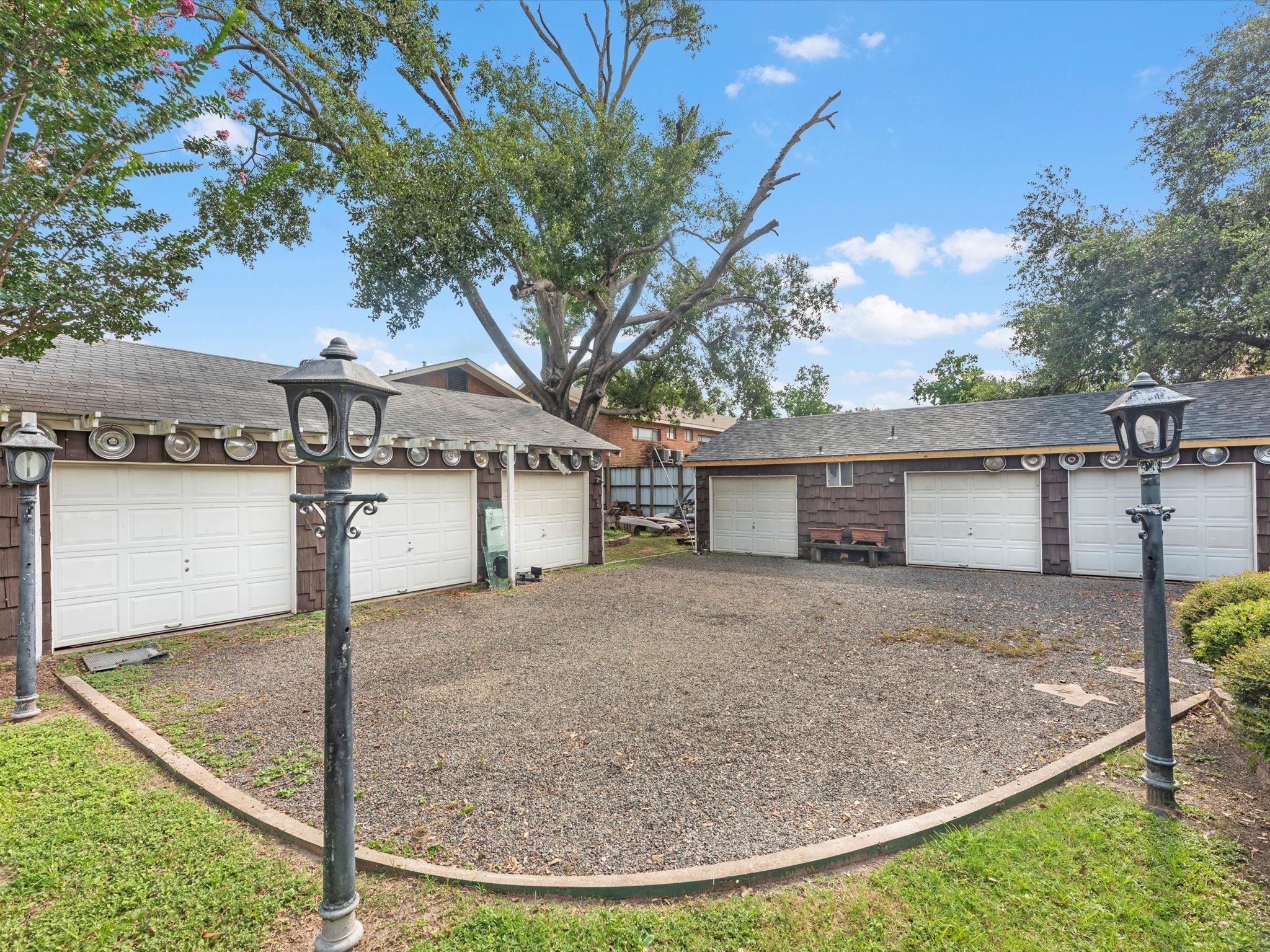 810 Martin Street Houston, TX 77018 - Photo 4 of 31 Car enthusiasts will love the expansive 6-car garage, offering ample space for a prized collection, workshop, or storage — the ultimate dream setup for any automotive passion.