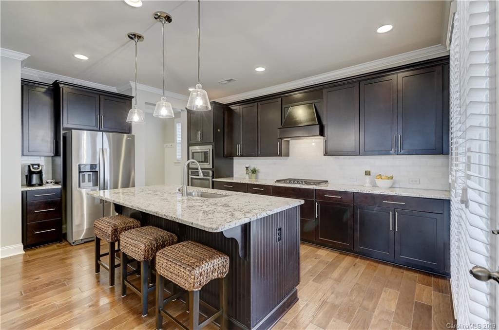 108 Helton Lane Fort Mill, SC 29708 - Photo 13 of 48 a kitchen with a sink cabinets and wooden floor