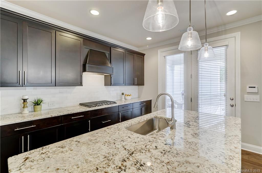 108 Helton Lane Fort Mill, SC 29708 - Photo 15 of 48 a kitchen with granite countertop stainless steel appliances a sink stove and refrigerator