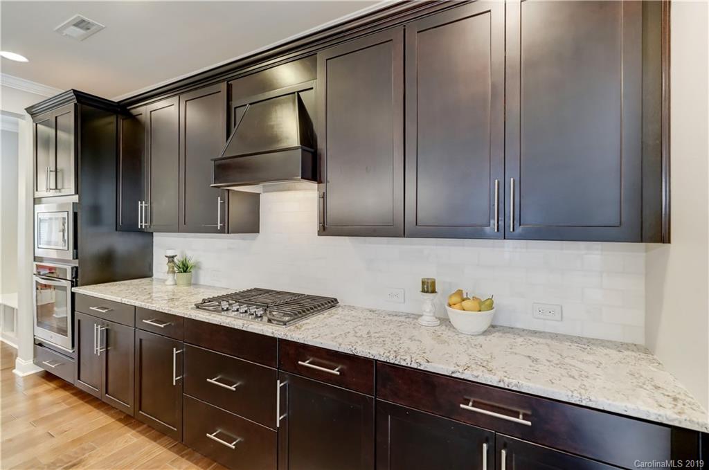 108 Helton Lane Fort Mill, SC 29708 - Photo 16 of 48 a kitchen with stainless steel appliances granite countertop a sink stove and refrigerator