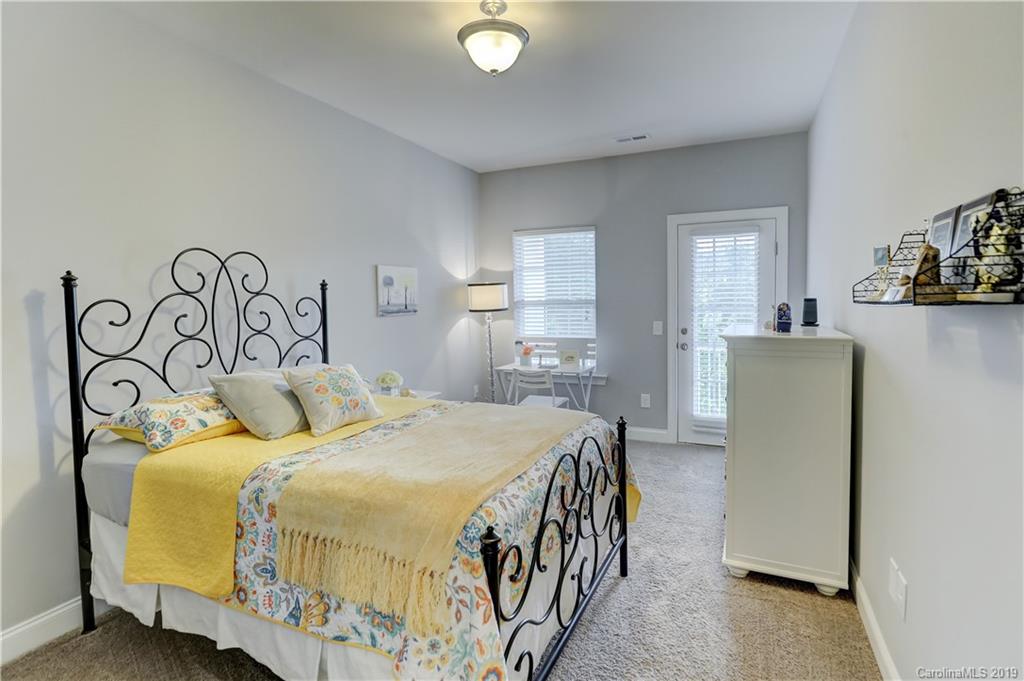 108 Helton Lane Fort Mill, SC 29708 - Photo 28 of 48 a bedroom with a bed and a table in it