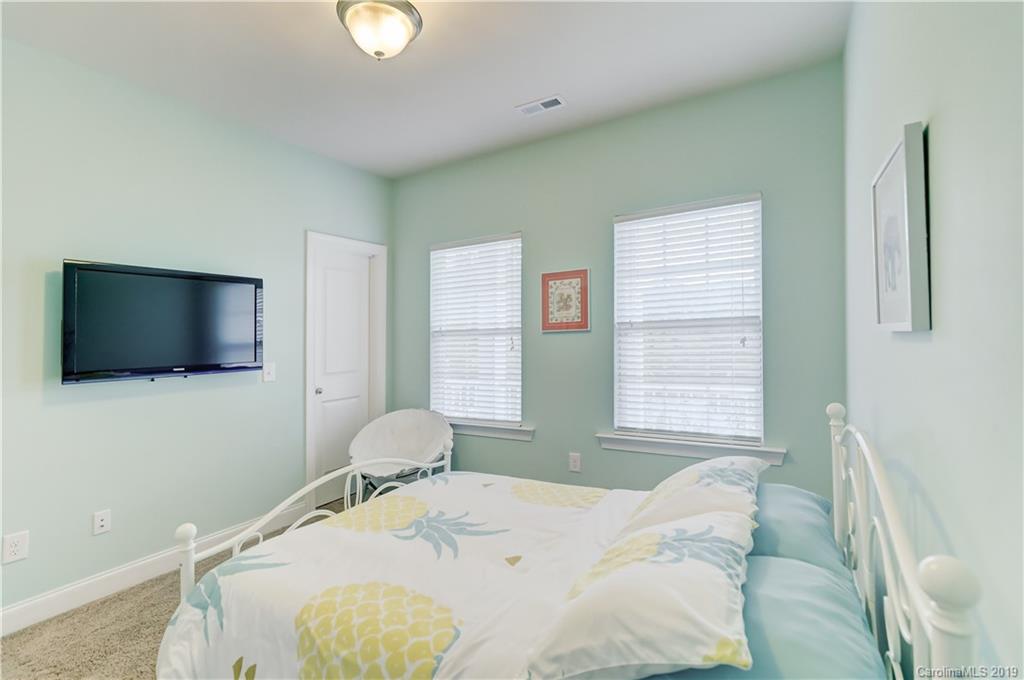 108 Helton Lane Fort Mill, SC 29708 - Photo 31 of 48 a bedroom with a bed and a flat screen tv