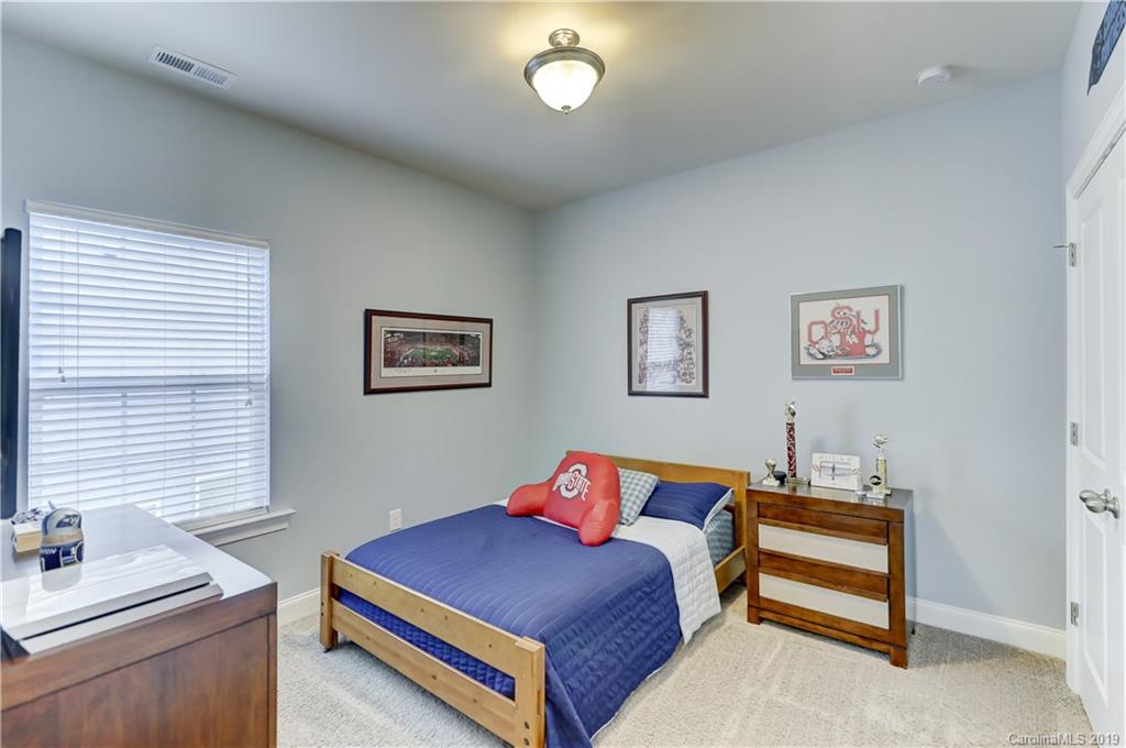 108 Helton Lane Fort Mill, SC 29708 - Photo 33 of 48 a bedroom with a bed and a desk