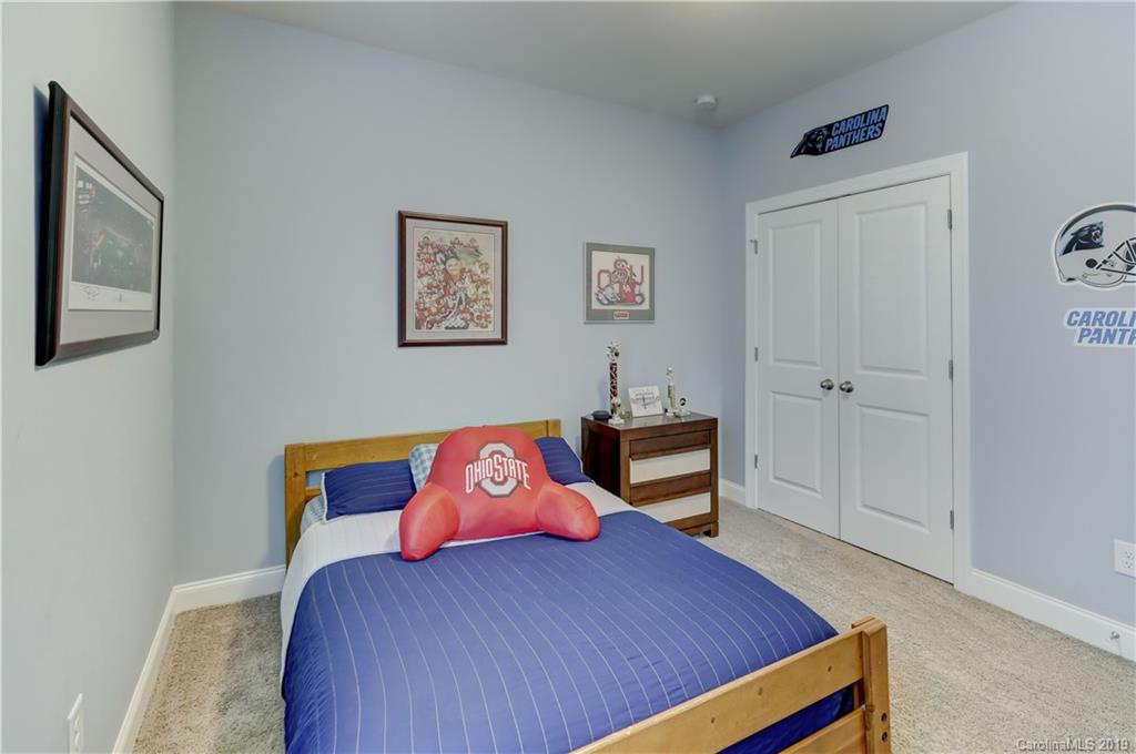 108 Helton Lane Fort Mill, SC 29708 - Photo 34 of 48 a bedroom with a bed and wooden floor