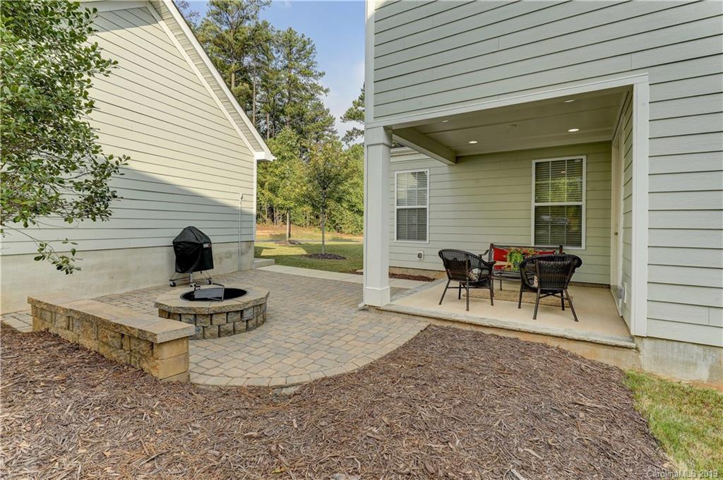 108 Helton Lane Fort Mill, SC 29708 - Photo 42 of 48 a view of a backyard with a patio and a fire pit