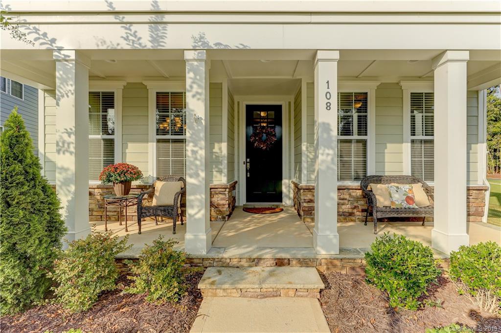 108 Helton Lane Fort Mill, SC 29708 - Photo 7 of 48 front view of a house with a chairs and table in a patio