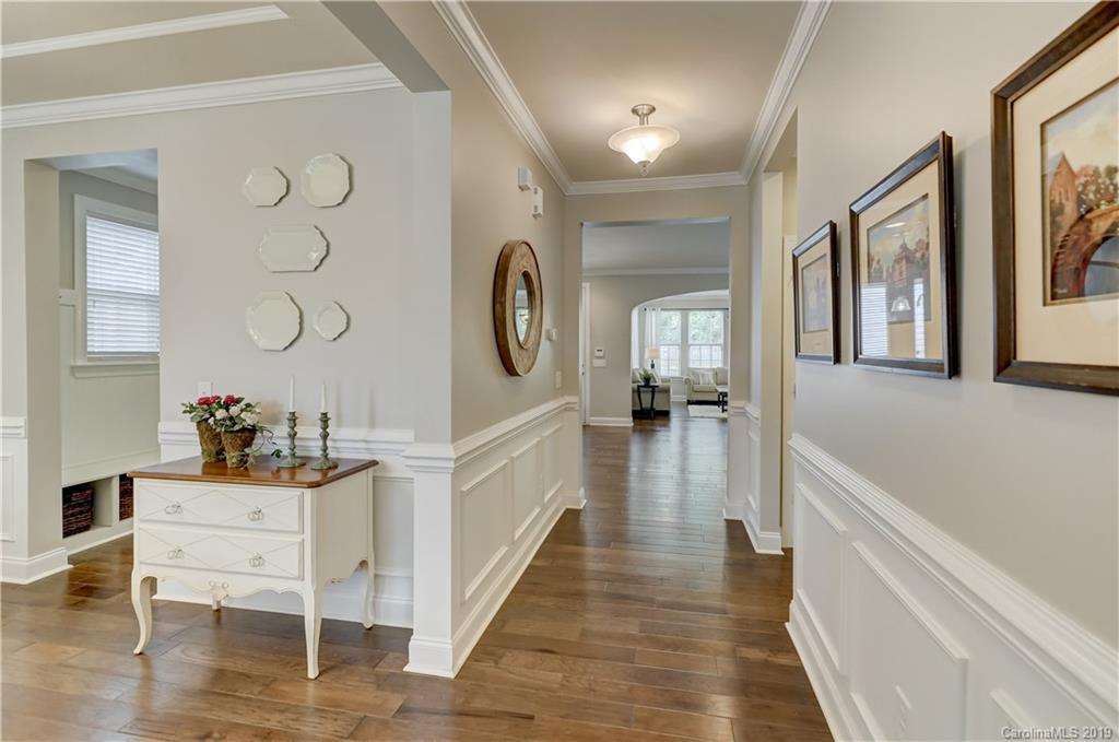 108 Helton Lane Fort Mill, SC 29708 - Photo 8 of 48 a view of a hallway with wooden floor and windows