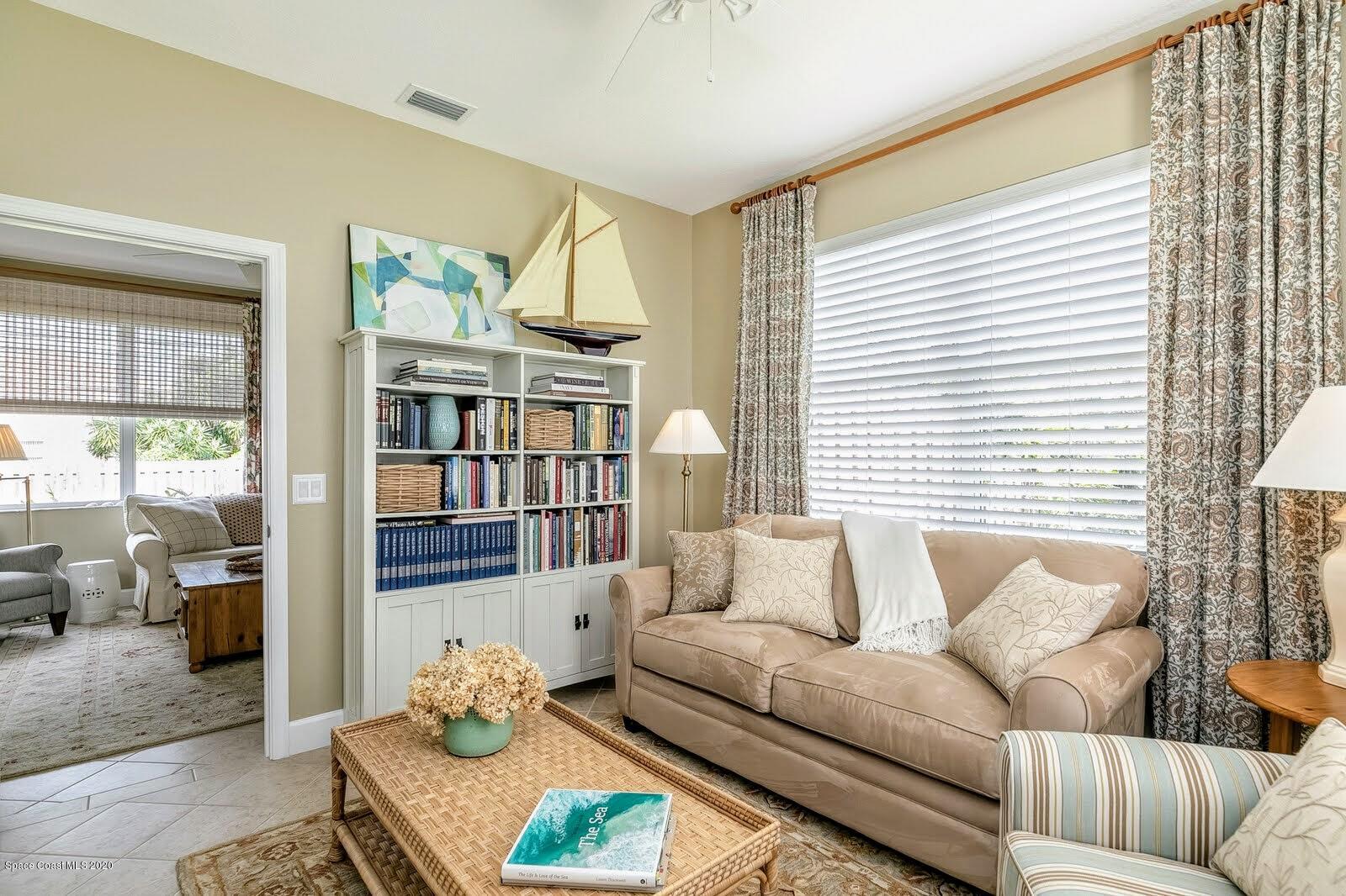 230 Richards Road Melbourne Beach, FL 32951 - Photo 12 of 42 a living room with furniture and a large window