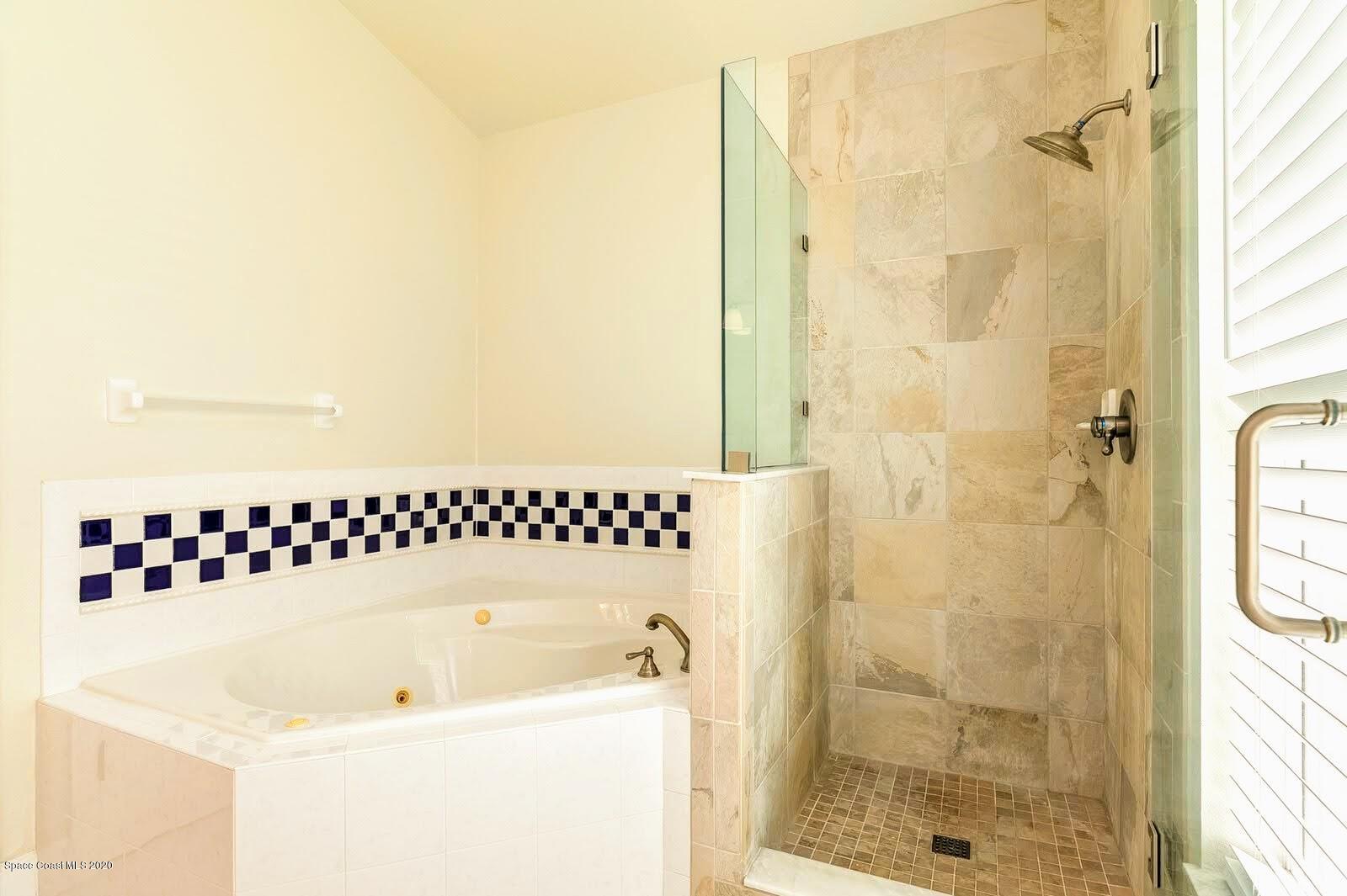 230 Richards Road Melbourne Beach, FL 32951 - Photo 17 of 42 a bathroom with a bathtub and shower