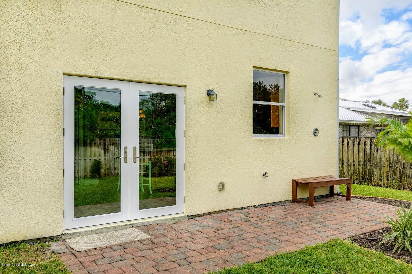 230 Richards Road Melbourne Beach, FL 32951 - Photo 26 of 42 a front view of a house with a yard