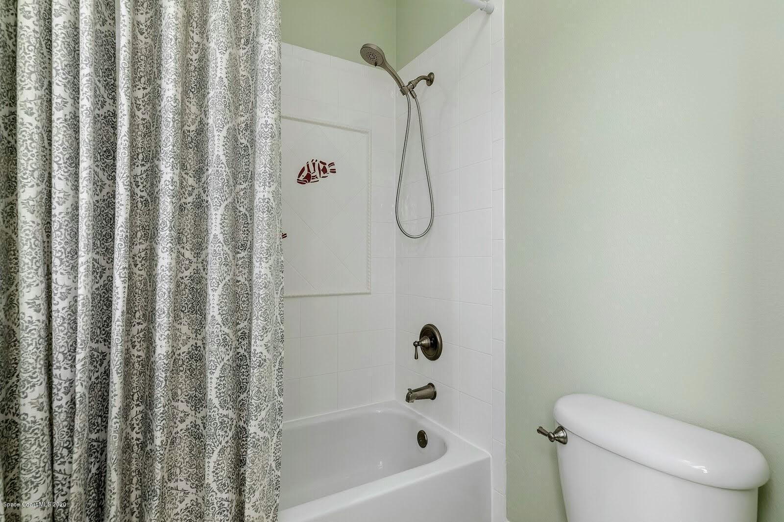 230 Richards Road Melbourne Beach, FL 32951 - Photo 29 of 42 a bathroom with a toilet and shower