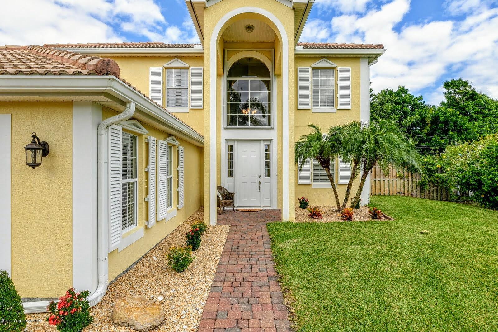 230 Richards Road Melbourne Beach, FL 32951 - Photo 34 of 42 a front view of a house with a yard