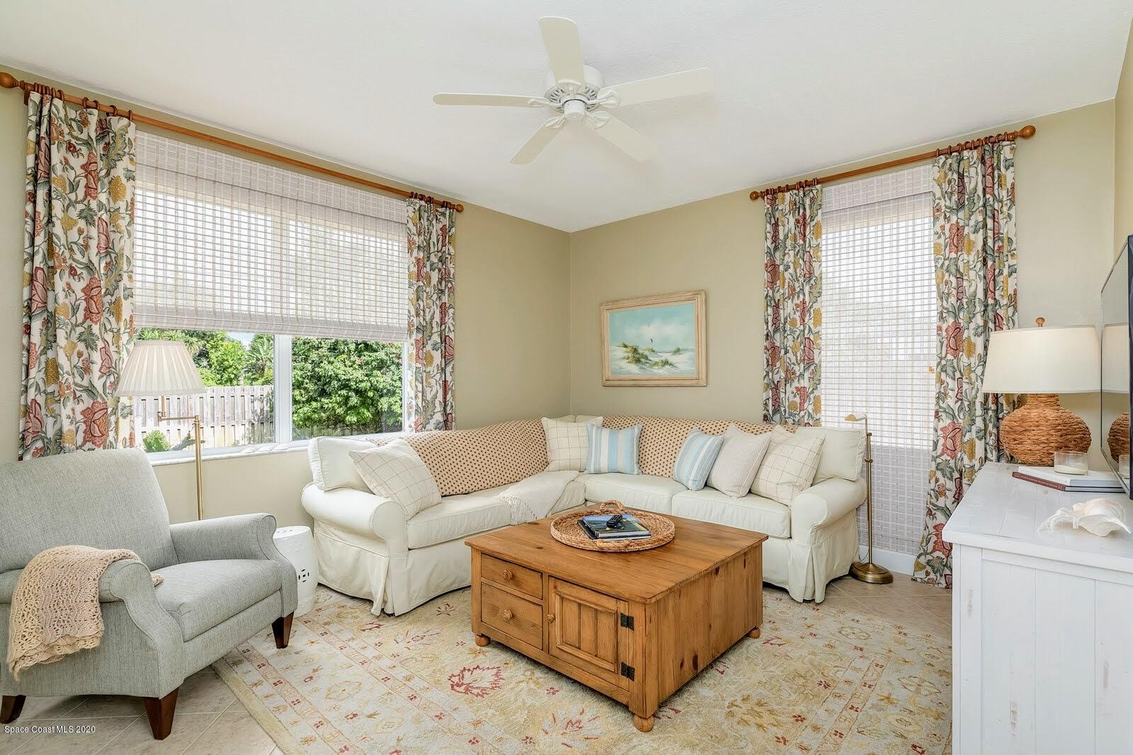 230 Richards Road Melbourne Beach, FL 32951 - Photo 10 of 42 a living room with furniture and a large window