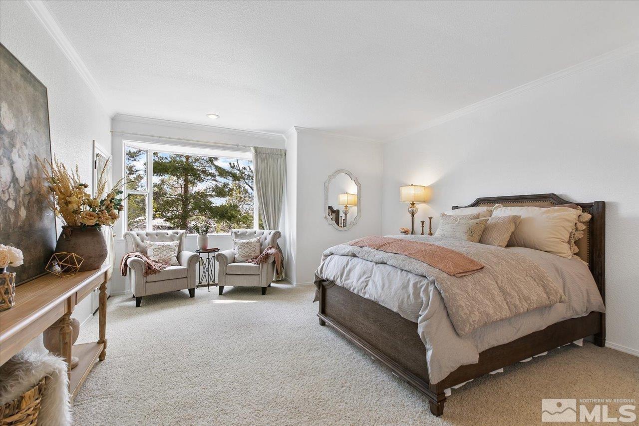 4035 Caughlin Creek Road Reno, NV 89519 - Photo 16 of 40 a spacious bedroom with a bed and large windows