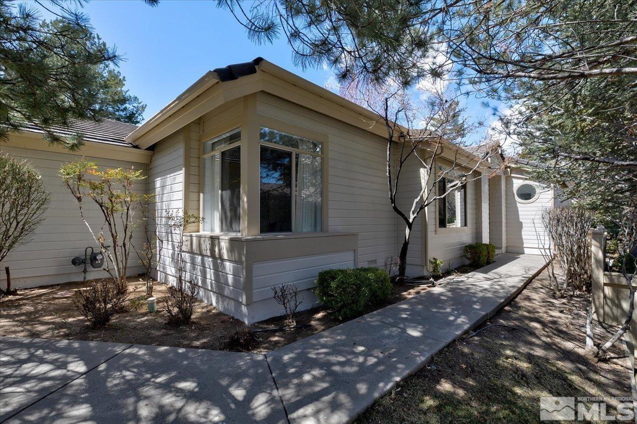 4035 Caughlin Creek Road Reno, NV 89519 - Photo 2 of 40 a front view of a house with a yard