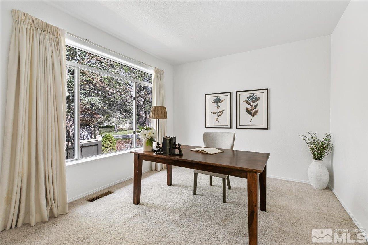 4035 Caughlin Creek Road Reno, NV 89519 - Photo 24 of 40 a view of a workspace with furniture and a window