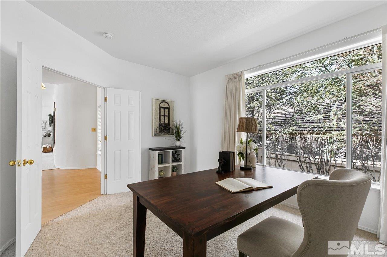 4035 Caughlin Creek Road Reno, NV 89519 - Photo 25 of 40 a view of a dining room with furniture window and wooden floor