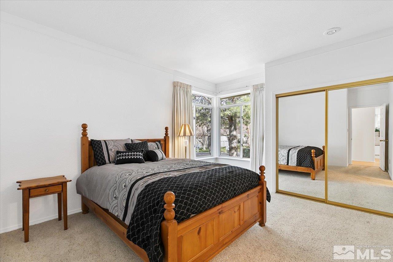 4035 Caughlin Creek Road Reno, NV 89519 - Photo 26 of 40 a bedroom with a bed and a large window