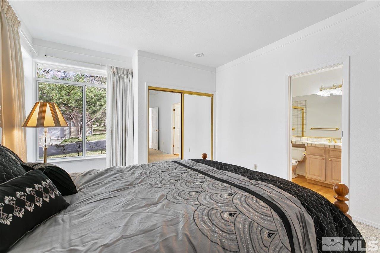 4035 Caughlin Creek Road Reno, NV 89519 - Photo 27 of 40 a bedroom with a bed and a window