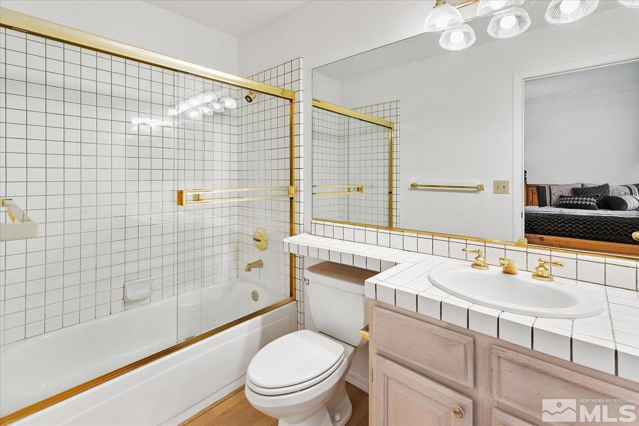 4035 Caughlin Creek Road Reno, NV 89519 - Photo 28 of 40 a bathroom with a sink a toilet and shower