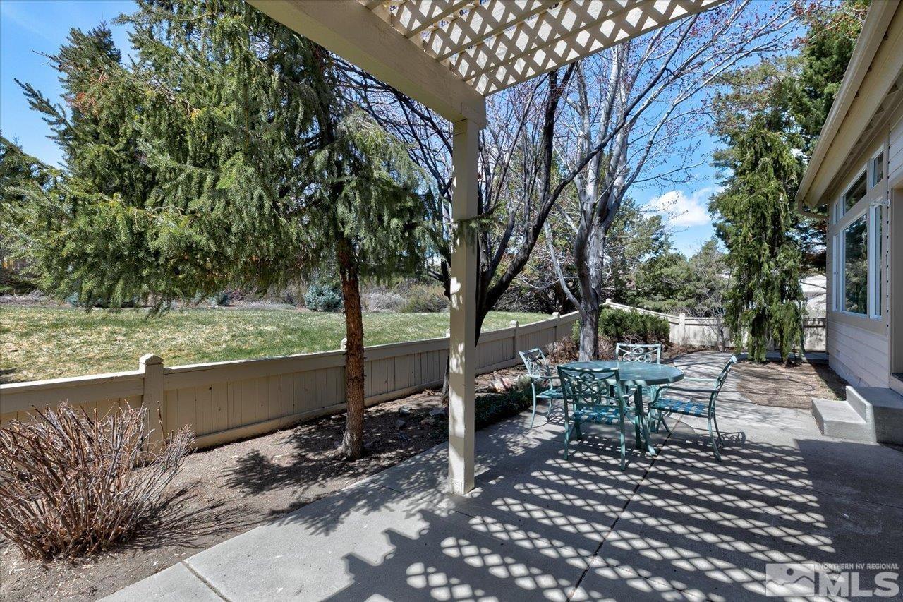 4035 Caughlin Creek Road Reno, NV 89519 - Photo 32 of 40 a view of a patio with wooden fence