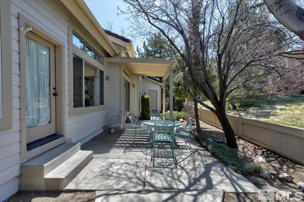 4035 Caughlin Creek Road Reno, NV 89519 - Photo 33 of 40 a view of a house with backyard and sitting area