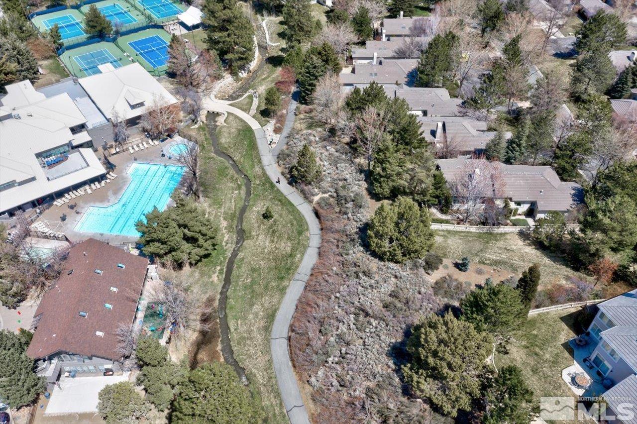 4035 Caughlin Creek Road Reno, NV 89519 - Photo 39 of 40 an aerial view of a house with a yard and lake view