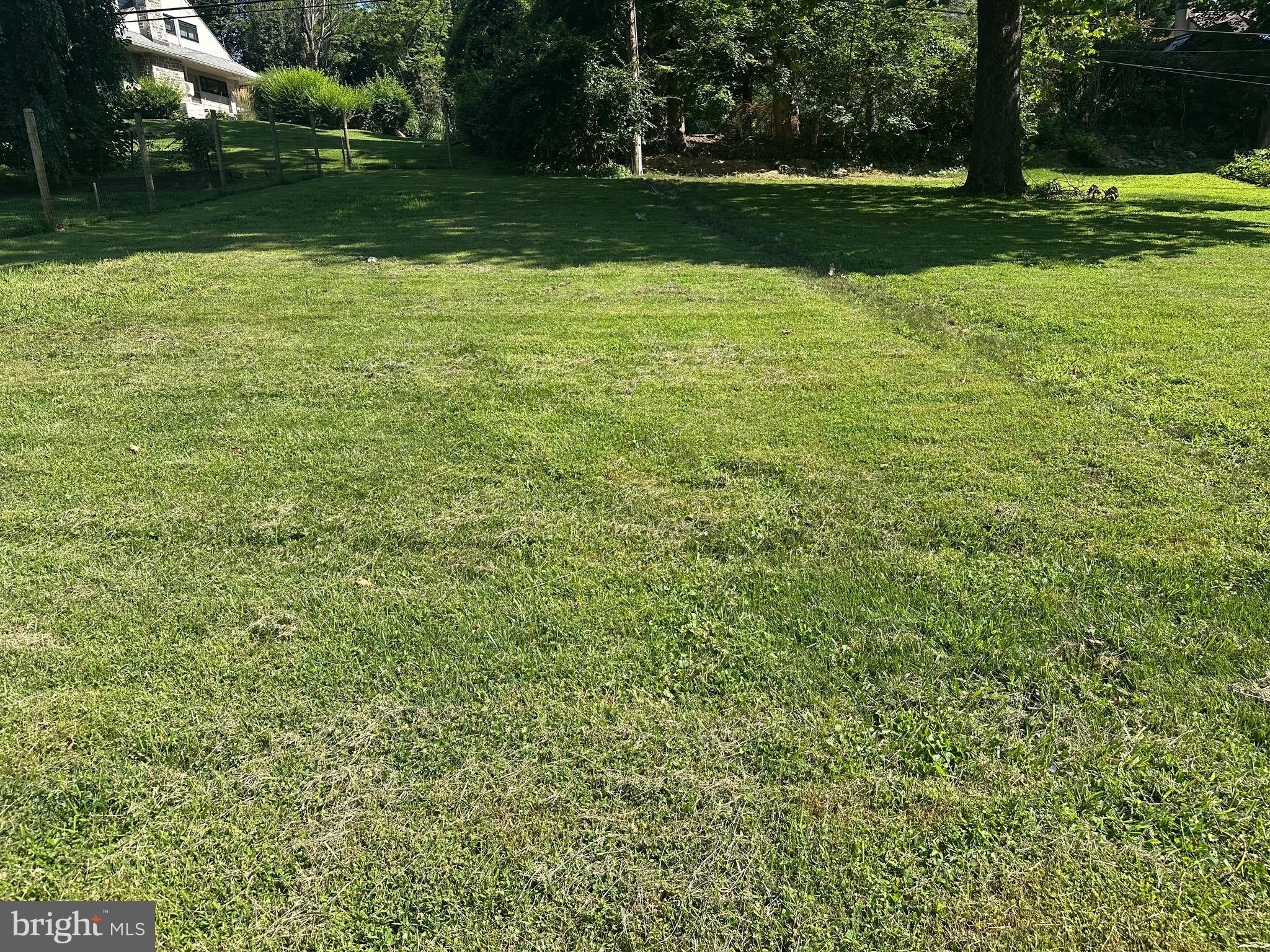713 Woodfield Road Villanova, PA 19085 - Photo 30 of 37 a view of a golf course with a yard