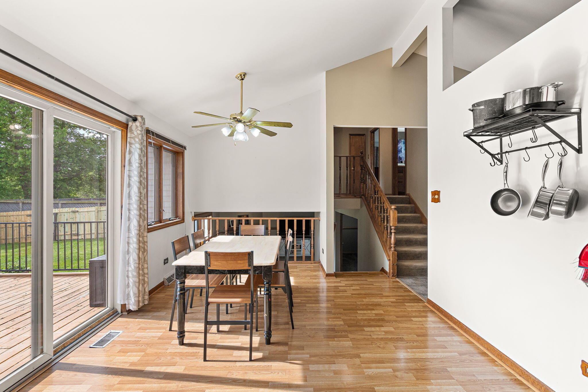 8987 Calhoun Place Crown Point, IN 46307 - Photo 11 of 28 a dining room with furniture and wooden floor