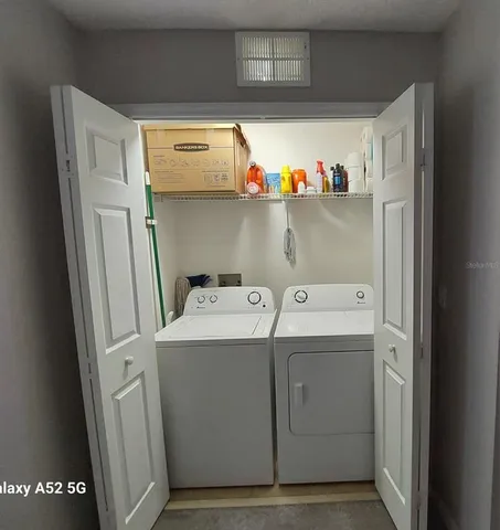 a utility room with dryer and washer