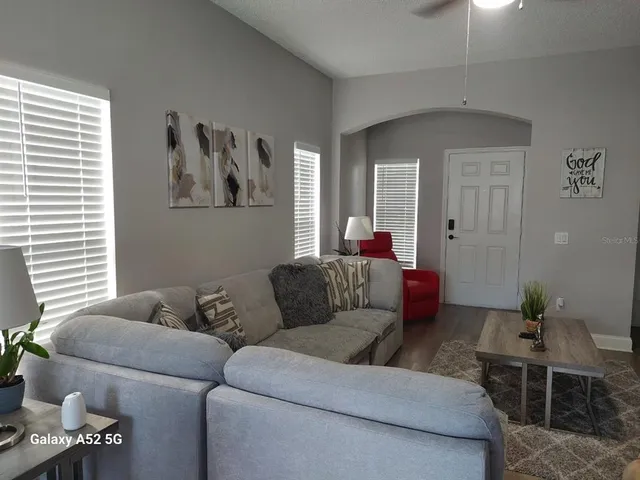 a living room with furniture and a window