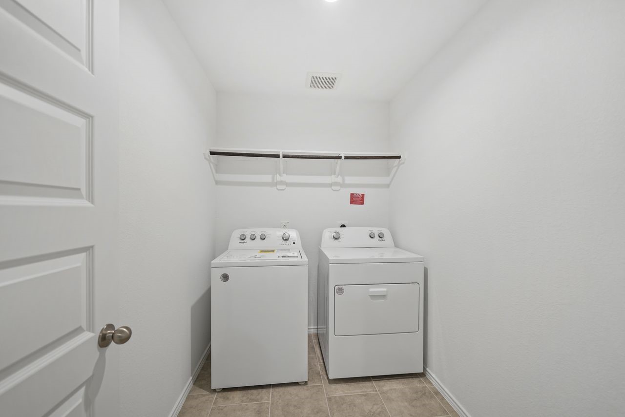 7502 Fierce Friesian Lane Rosharon, TX 77583 - Photo 15 of 21 a view of utility room with dryer and washer