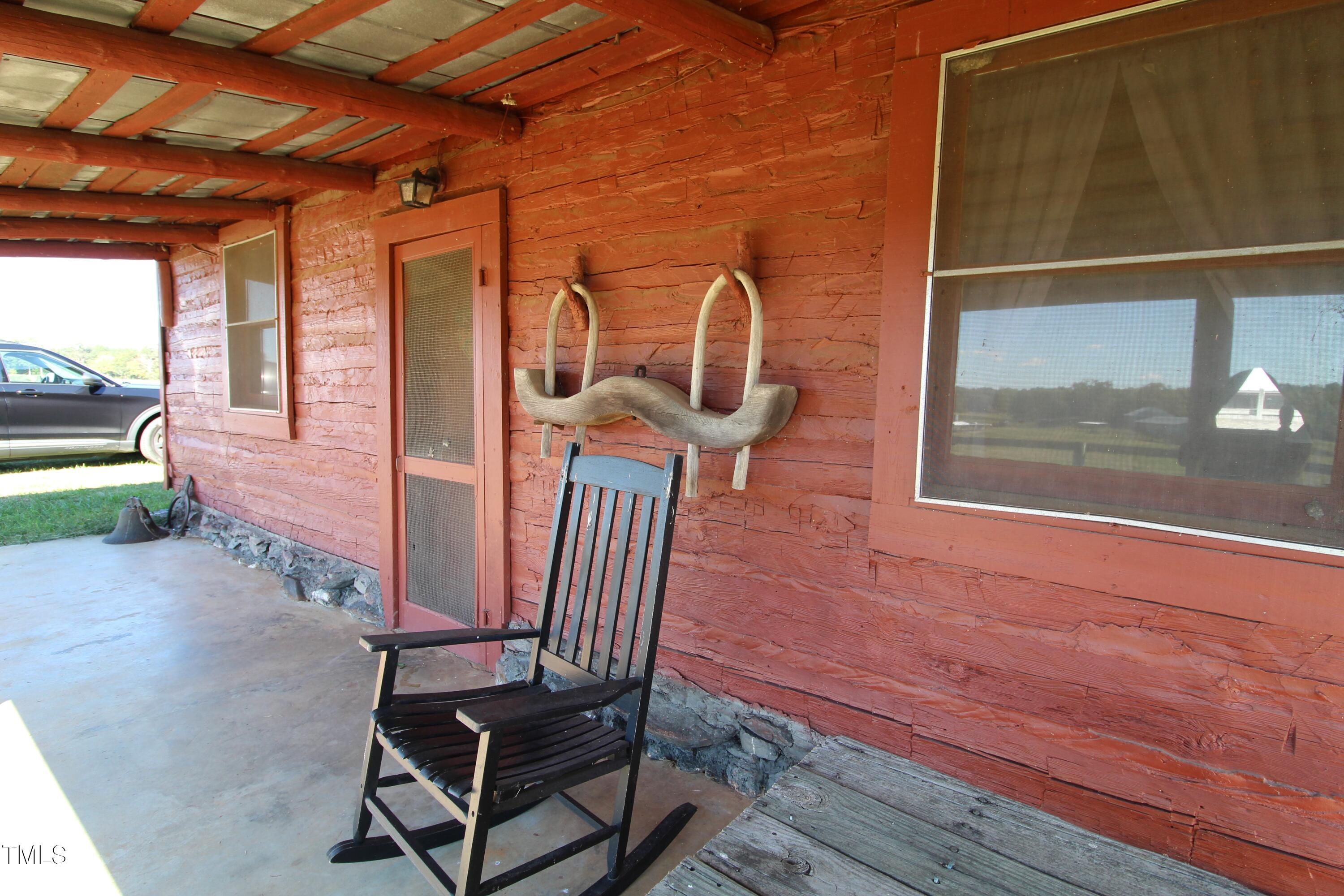 455 Hogan Farm Road Seagrove, NC 27341 - Photo 53 of 70 a view of a door with a chairs and table in the patio